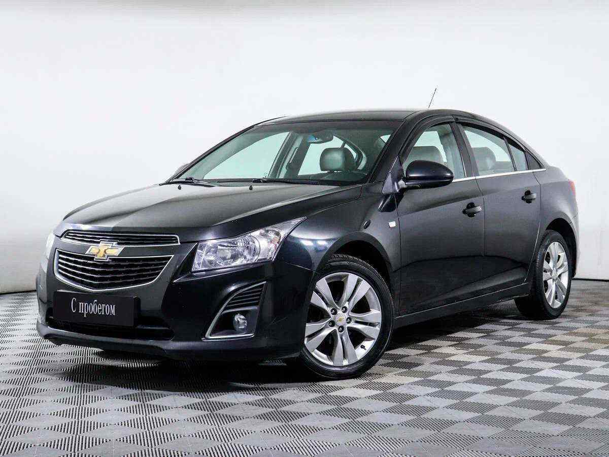 Cruze 1.8 2012. Chevrolet Cruze 2012 черный. Chevrolet Cruze 1 Рестайлинг. Шевроле Круз хэтчбек черный. Chevrolet Cruze темно серый.